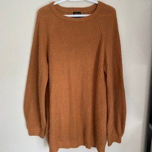 A brown knit sweater